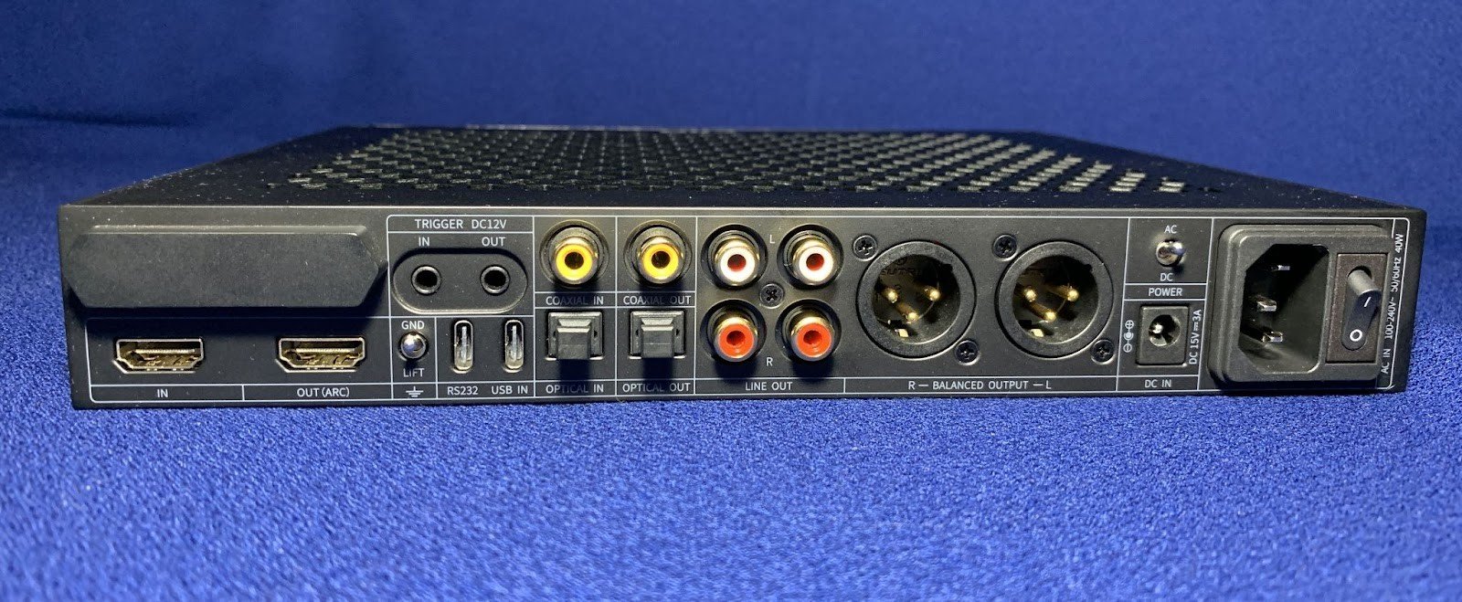 The rear panel is full of various interfaces and controls